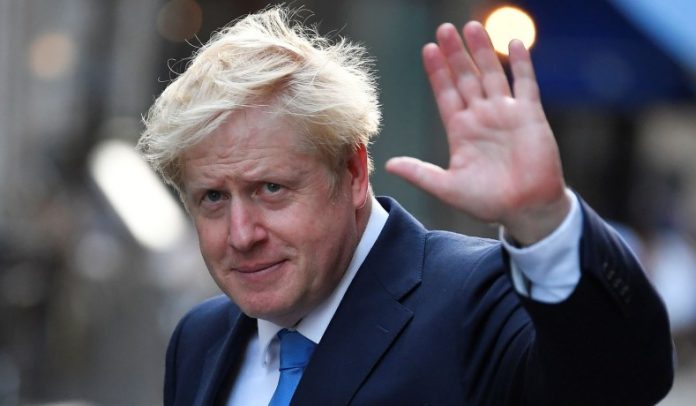 Boris Johnson, leader of the Britain's Conservative Party, leaves a private reception in central London