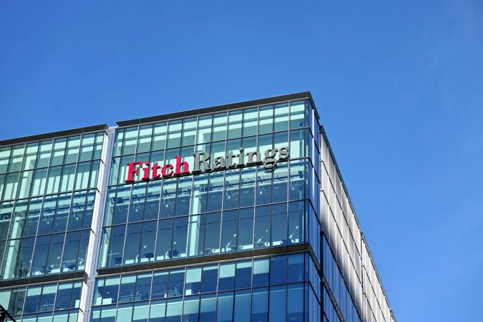 Fitch Ratings logo signage at top of their Headquarters in UK