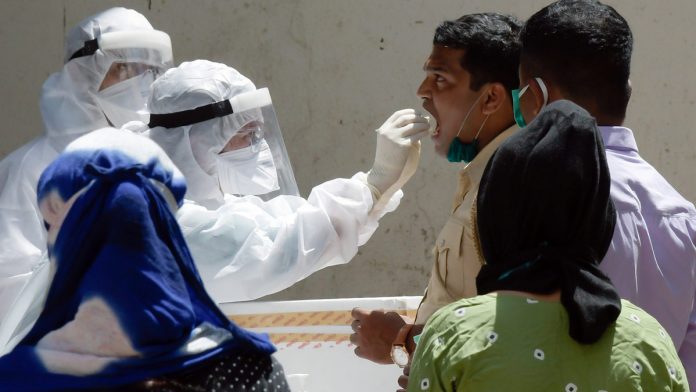 BMC doctors taking samples of police who have a cold and cough for testing of Covid19