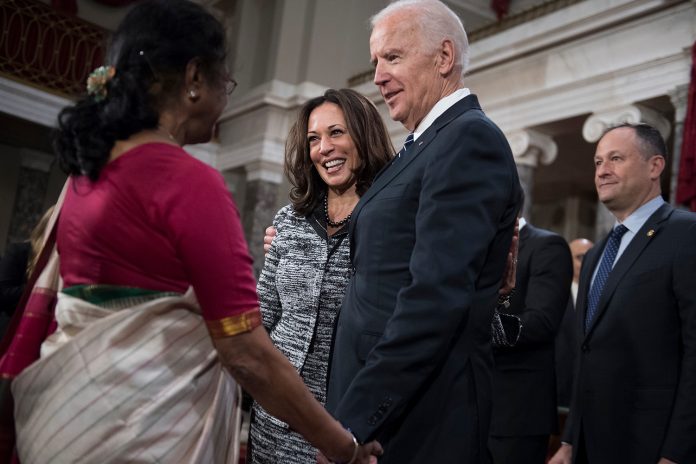 Joe- Biden shake hands with Indian woman Joe- Biden shake hands with Indian woman