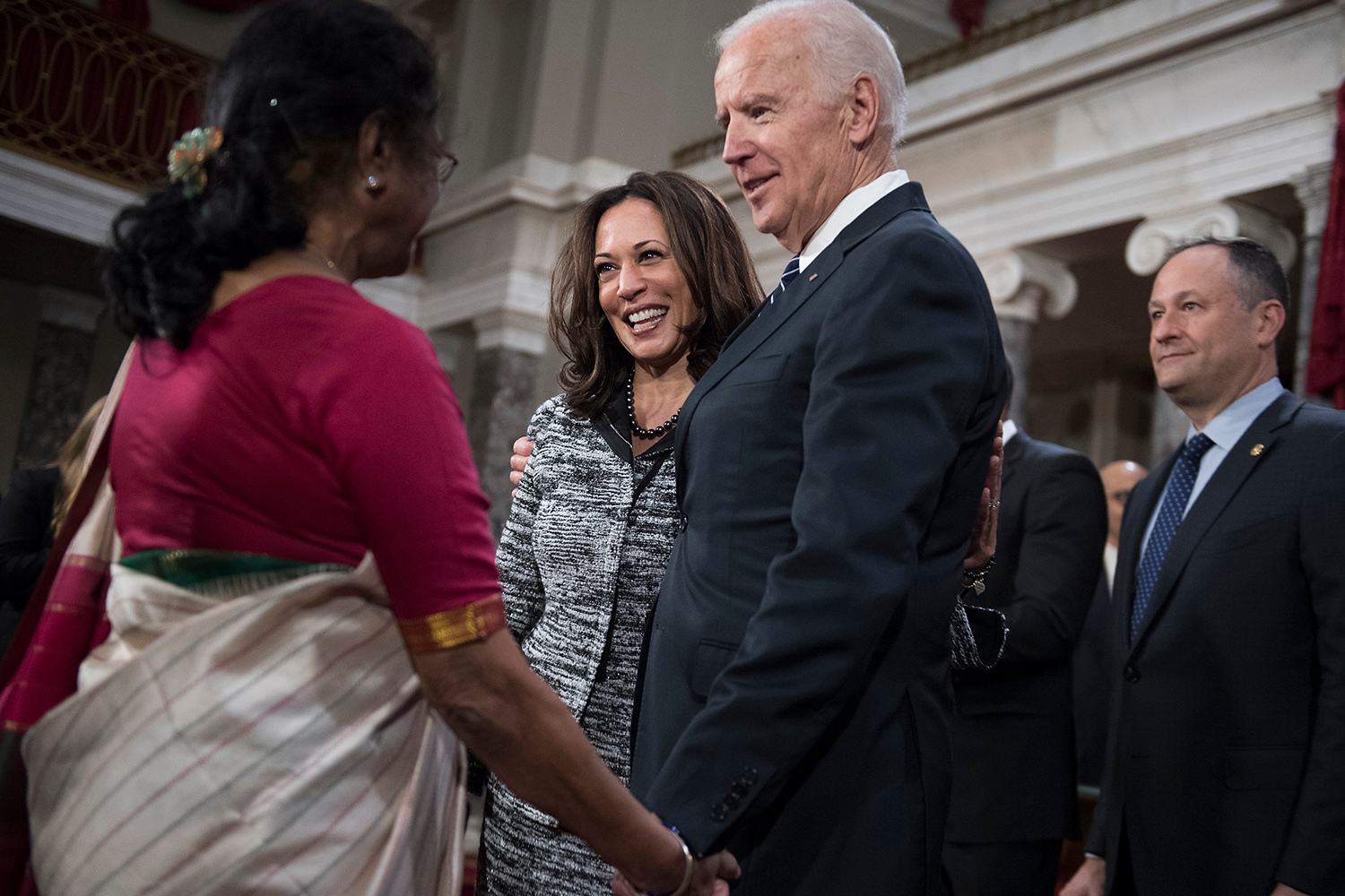 Joe- Biden shake hands with Indian woman