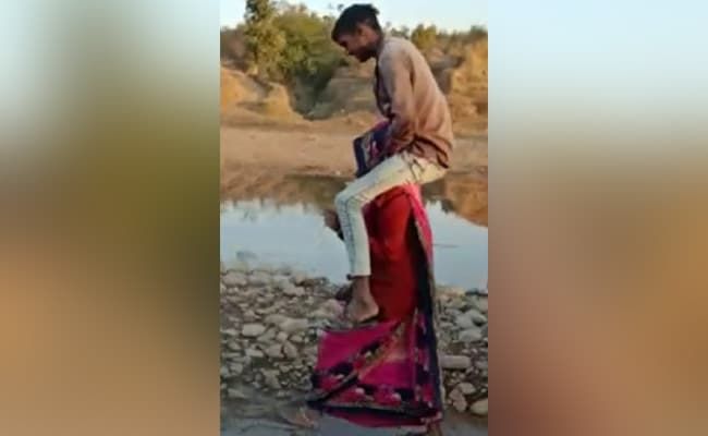 woman forced to carry husband's relative on shoulders in Madhya Pradesh