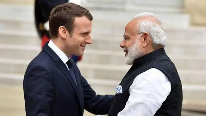 911381-modi-emmanuel-macron-jpg