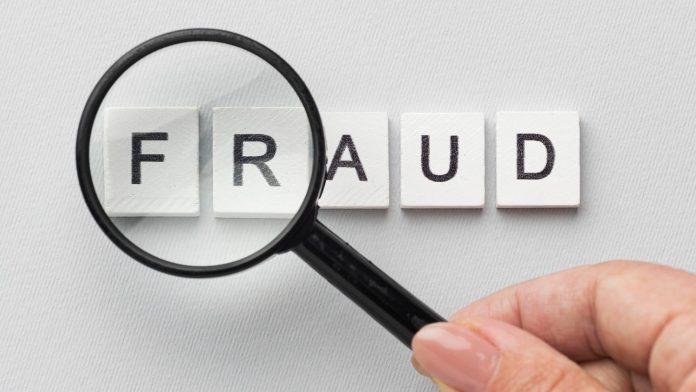 fraud_word_magnifying_glass