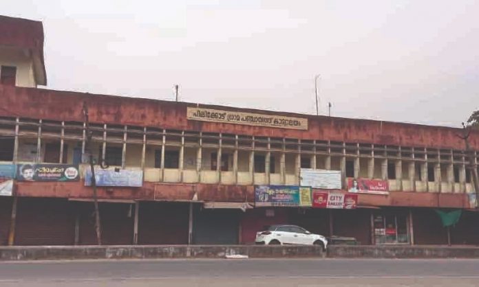 1374359-kalikkadavu-panchayat-shopping-complex_11zon